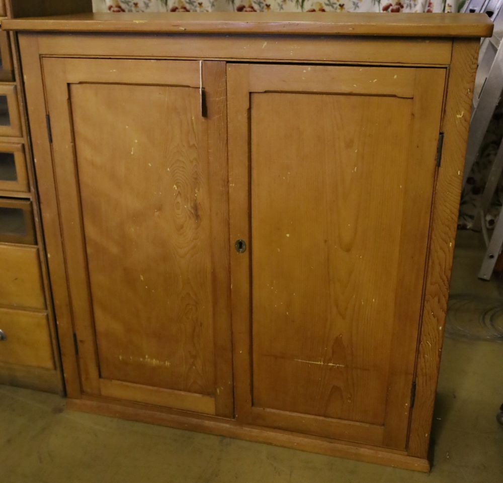 A late Victorian pine two door cupboard, width 123cm depth 52cm height 125cm
